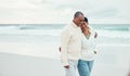 Senior couple, hug and beach walk together with funny moment, comic memory or conversation by sea. Happy retirement