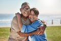 Senior couple, hug and happy on vacation being romantic, smile or bonding to celebrate marriage, anniversary or beach Royalty Free Stock Photo