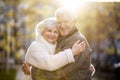 Senior couple hugging outdoors Royalty Free Stock Photo