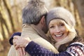 Senior couple hugging outdoors in winter Royalty Free Stock Photo