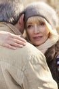 Senior couple hugging outdoors in winter Royalty Free Stock Photo