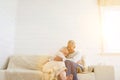 Senior Couple Hugging on Sofa Royalty Free Stock Photo