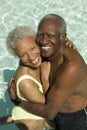 Senior Couple Hugging In Swimming Pool Royalty Free Stock Photo