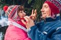 Senior couple hugging in winter forest. Man and woman walking outdoors. Winter activities Royalty Free Stock Photo