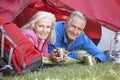 Senior Couple Inside Tent On Camping Holiday Royalty Free Stock Photo