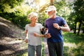 Senior couple jogging and running outdoors in nature