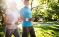 Senior couple jogging and running outdoors in nature Royalty Free Stock Photo