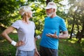 Senior couple jogging and running outdoors in nature Royalty Free Stock Photo