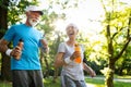 Senior couple jogging and running outdoors in nature Royalty Free Stock Photo