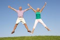 Senior couple jumping in air Royalty Free Stock Photo