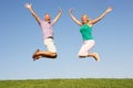 Senior couple jumping in air Royalty Free Stock Photo