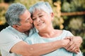 Senior couple, kiss and hug in park, garden and nature for love, care and happiness together. Happy man, woman and Royalty Free Stock Photo