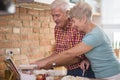 Senior couple at the kitchen Royalty Free Stock Photo