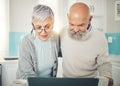 Senior couple, laptop and video call in home kitchen, internet browsing or social media in house. Computer, retirement Royalty Free Stock Photo