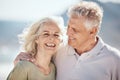 Senior couple, laughing and outdoor at beach with happiness, freedom and care on vacation. Face of a man and woman on Royalty Free Stock Photo