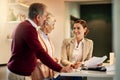 Senior couple, lawyer and documents in discussion for budget or retirement plan at home. Happy elderly man and woman Royalty Free Stock Photo