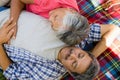 Senior couple laying on blanket Royalty Free Stock Photo
