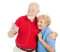 Senior Couple Listening to MP3s Royalty Free Stock Photo