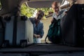 Senior couple loading bags in car trunk Royalty Free Stock Photo