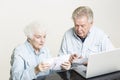 Senior couple is looking at bills concerned