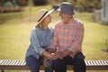 Senior couple looking at each other while sitting on a bench Royalty Free Stock Photo