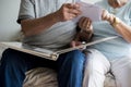 Senior couple looking at family photo album Royalty Free Stock Photo