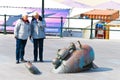 Senior couple looking at a sculpture