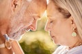 Senior, couple, love and trust while together in retirement for love, care and trust on a summer vacation outdoor. Face