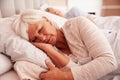 Senior Couple Lying Asleep In Bed Together Royalty Free Stock Photo