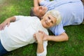 Senior couple lying on grass Royalty Free Stock Photo