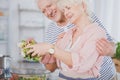 Senior couple making salad