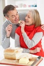 Senior Couple Making Sandwich In Kitchen Royalty Free Stock Photo
