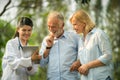 Senior couple talking to nurse or caregiver. Royalty Free Stock Photo