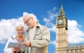 Senior couple with map over london big ben tower Royalty Free Stock Photo