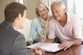 Senior Couple Meeting With Financial Advisor At Home Royalty Free Stock Photo