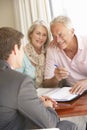 Senior Couple Meeting With Financial Advisor At Home Royalty Free Stock Photo