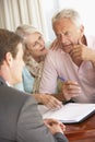 Senior Couple Meeting With Financial Advisor At Home Looking Worried Royalty Free Stock Photo