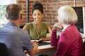 Senior Couple Meeting With Financial Advisor In Office Royalty Free Stock Photo