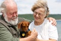 Senior couple with Miniature Dachshund