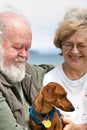 Senior couple with Miniature Dachshund