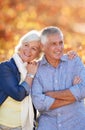 Senior couple, nature and thinking of future together in autumn, park or vineyard or happy, marriage in retirement or