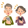 Senior couple operating a smartphone with a noticed face