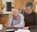Senior couple paying bills