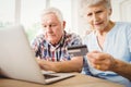 Senior couple paying bills online Royalty Free Stock Photo