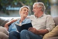 Senior, couple and pension people reading with a happy smile in a home living room sofa. Retirement of elderly man and Royalty Free Stock Photo