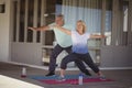 Senior couple performing stretching exercise Royalty Free Stock Photo