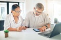 Senior couple, phone and finance in budget planning, invoice or documents together on table at home. Mature man and Royalty Free Stock Photo