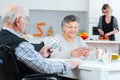 Senior couple playing cards