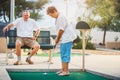 Senior couple playing miniature golf Royalty Free Stock Photo