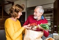 Senior couple preparing food in the kitchen. Royalty Free Stock Photo